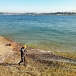 Nadar en la bahía con los montes de Soba nevados